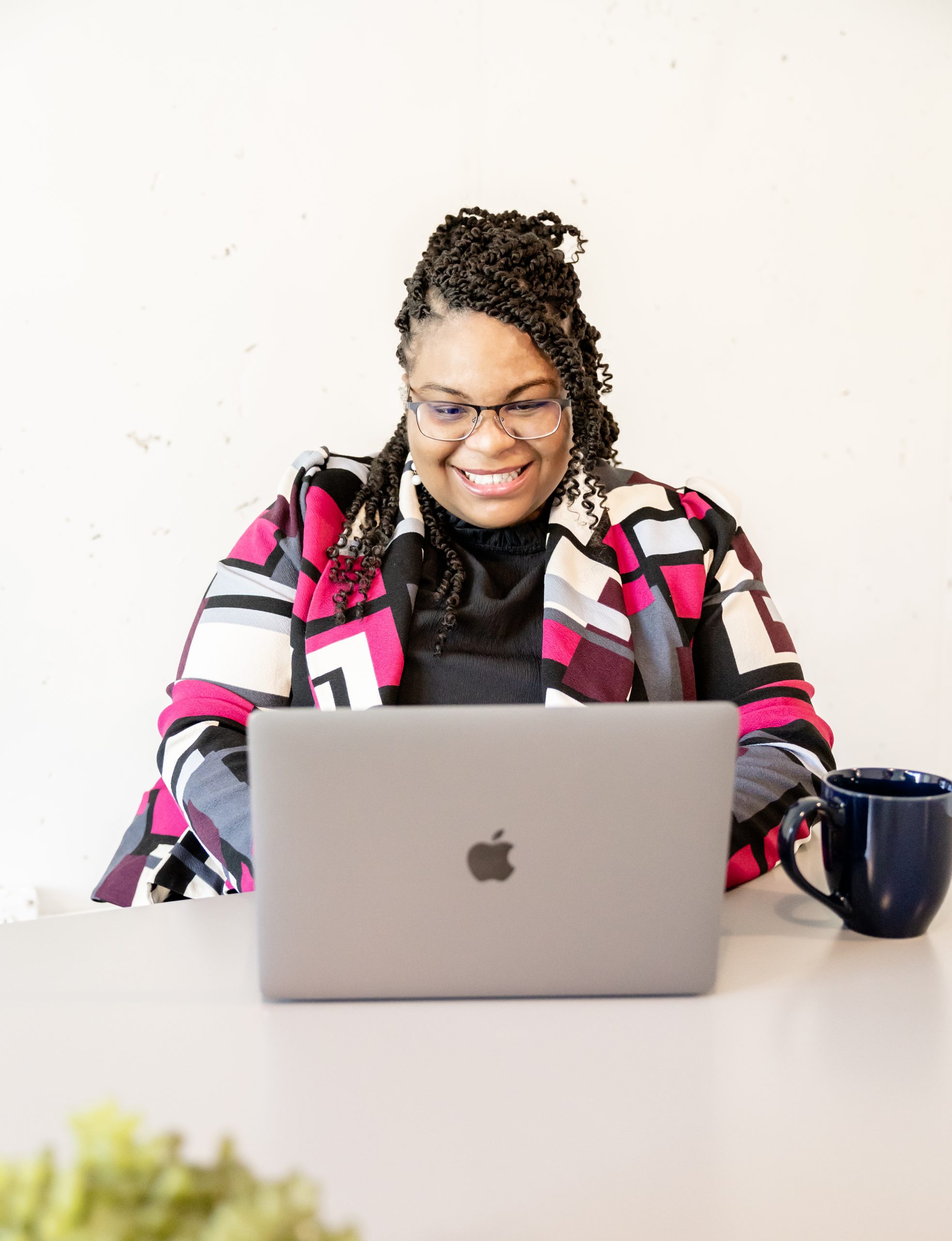 Anitra Deen working at her laptop